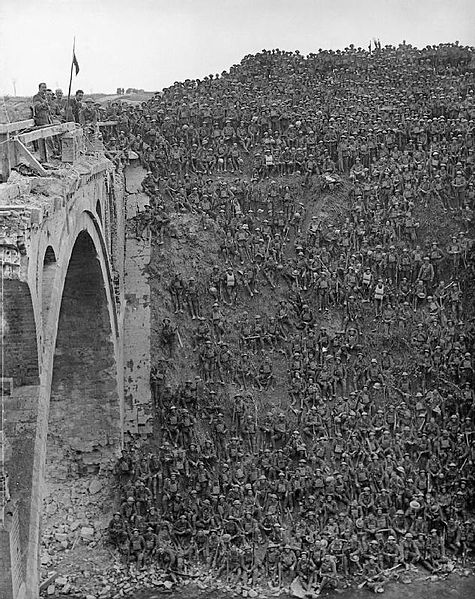 Men of the 137th Brigade, 46th Division, being addressed by Brigadier General J C Campbell VC CMG DSO on the Riqueval Bridge over the St Quentin Canal, which formed part of the German's Hindenburg Line, broken on 29 September 1918. 